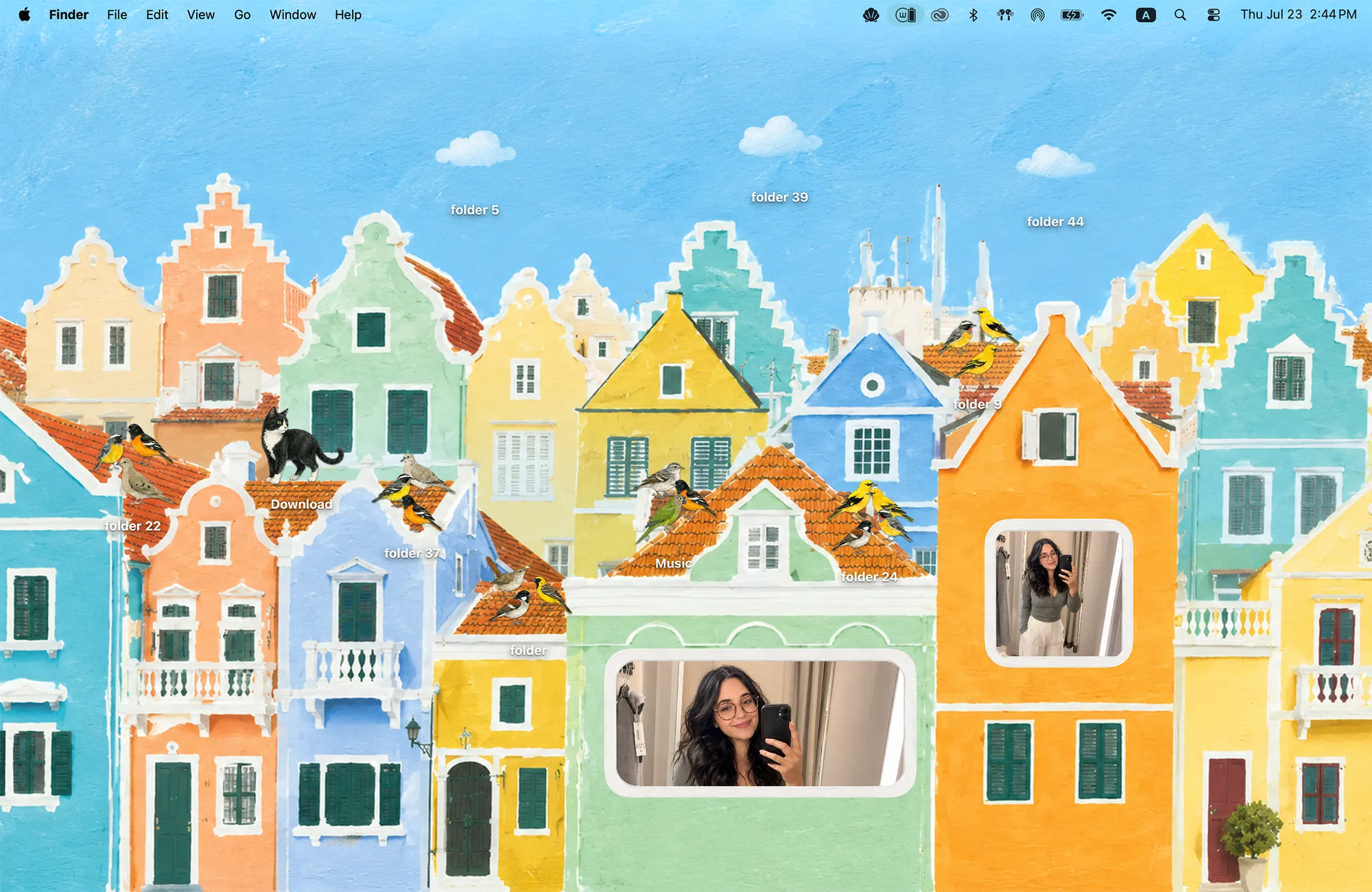 Curaçao desktop wallpaper, colorful Caribbean houses with Dutch gables, songbird folder icons, an island cat and postcard photo widgets