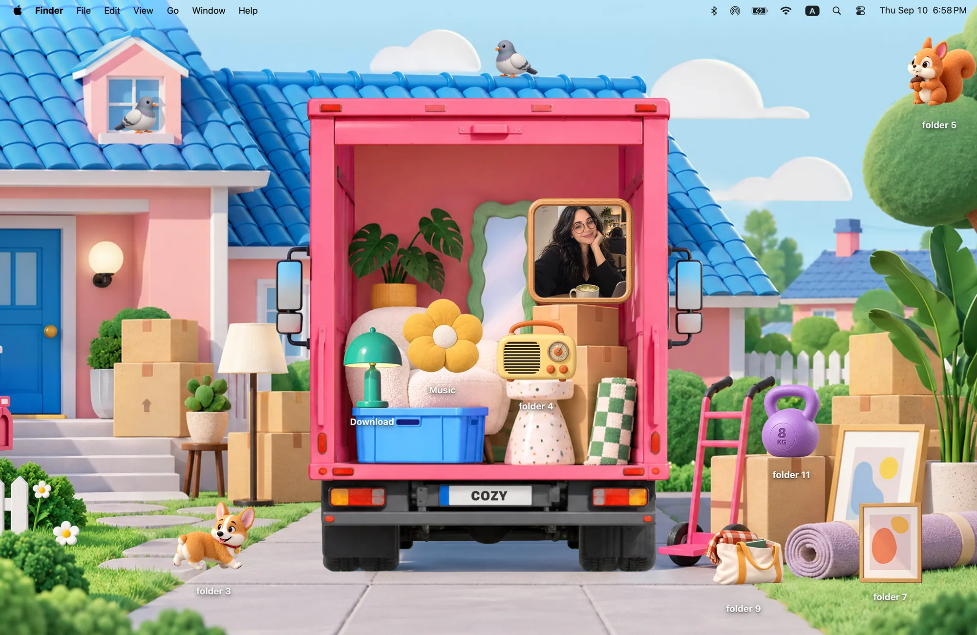 Moving Day 3D MacBook wallpaper, a pink moving truck outside a house with 3D folder icons like a lamp, a radio and a corgi, and a framed photo widget